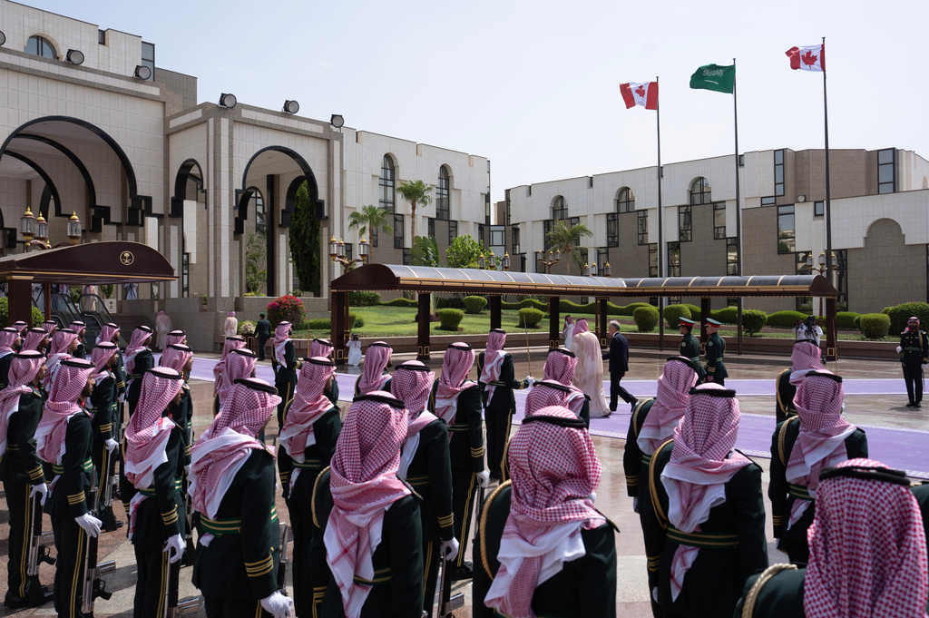 Canada Prime Minister Mark Carney walks with Saudi Arabia's Crown Prince Mohammed bin Salman as he arrives at the Royal Palace in Jeddah, Saudi Arabia, Thursday, July 9, 2026. (Adrian Wyld/The Canadian Press via AP)