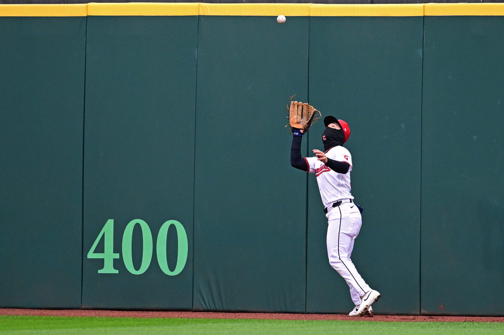 Cleveland Guardians center fielder Steven Kwan catches a ball hit by Chicago Cubs center fielder Pete Crow-Armstrong during the fourth inning of a baseball game, Sunday, April 5, 2026, in Cleveland. (AP Photo/David Dermer)