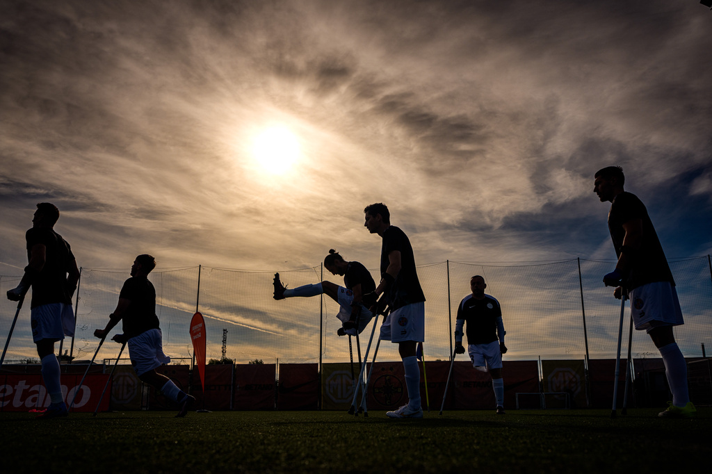 FCSB's players warm-up before an amputee soccer match between FCSB and AFAS in the inaugural EAFF Conference League in Bucharest, Romania, Thursday, Sept. 24, 2026. (AP Photo/Andreea Alexandru)