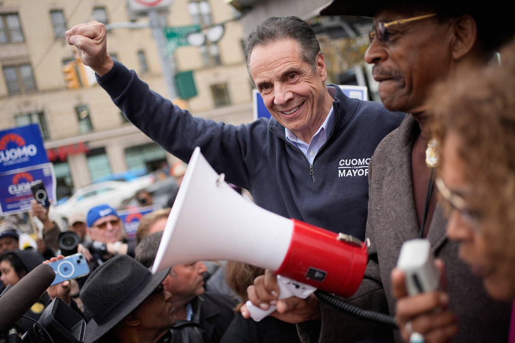 New York City mayoral candidate Andrew Cuomo cheers along with supporters while campaigning in New York, Monday, Nov. 3, 2025. (AP Photo/Seth Wenig)
