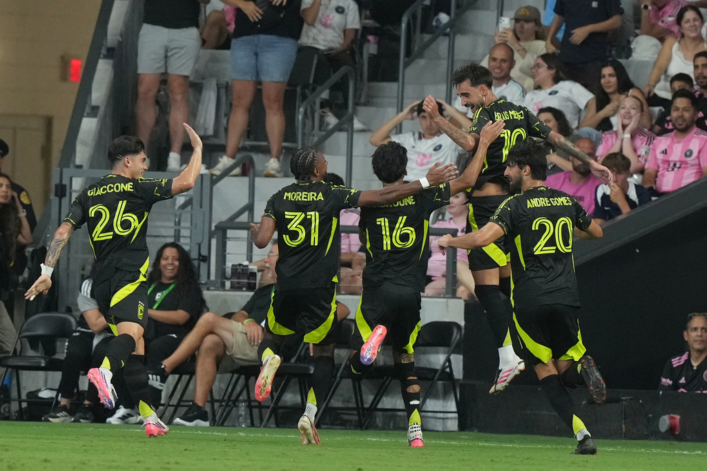 Columbus Crew midfieldier Brais Méndez (10), right, celebrates after scoring a goal during the second half of an MLS soccer match against Inter Miami , Saturday, Aug. 1, 2026, in Miami, Fla. (AP Photo/Marta Lavandier)