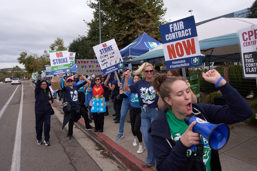 Kaiser Permanente health care workers hold signs and chant slogans while on strike in front of the Kaiser Permanente San Diego Medical Center Tuesday, Oct. 14, 2025, in San Diego. (AP Photo/Gregory Bull) Kaiser Permanente health care workers hold signs and chant slogans while on strike in front of the Kaiser Permanente San Diego Medical Center Tuesday, Oct. 14, 2025, in San Diego. (AP Photo/Gregory Bull)
