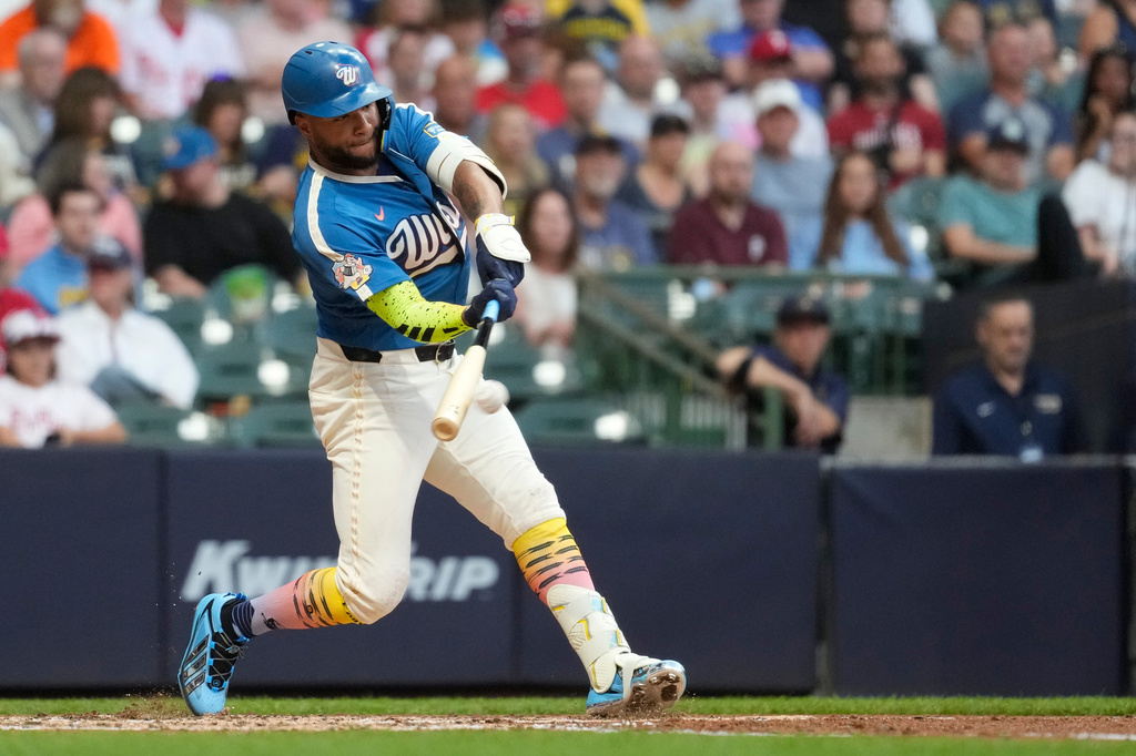 Milwaukee Brewers' Jackson Chourio hits an RBI single during the sixth inning of a baseball game against the Philadelphia Phillies, Friday, June 12, 2026, in Milwaukee. (AP Photo/Aaron Gash)