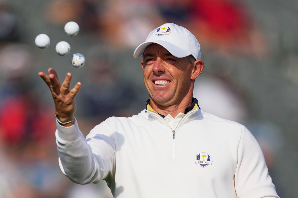 Europe's Rory McIlroy, of Northern Ireland, tosses balls in the air during a practice round for the Ryder Cup golf tournament, Tuesday, Sept. 23, 2025, in Farmingdale, N.Y., at Bethpage State Park's Black Course. (AP Photo/Matt Slocum)