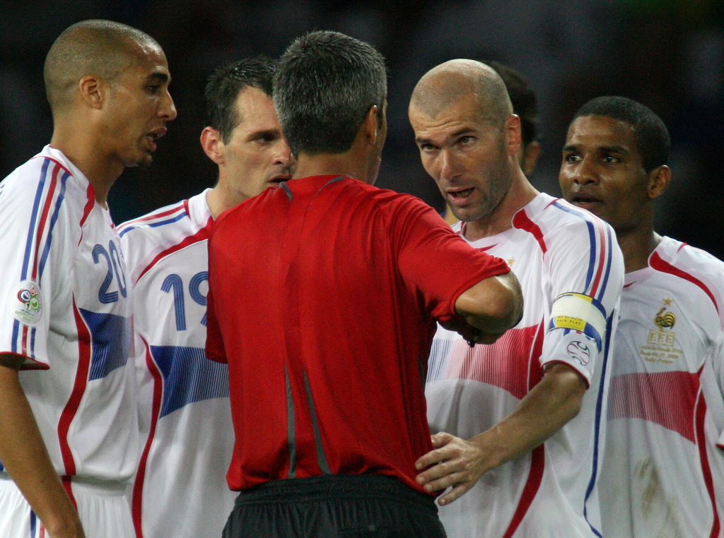 FILE- France's Zinedine Zidane, second from right, has words with Argentine Horacio Elizondo, center after receiving a red card during extra time in the final of the soccer World Cup between Italy and France in the Olympic Stadium in Berlin, on July 9, 2006. (AP Photo/Dusan Vranic)