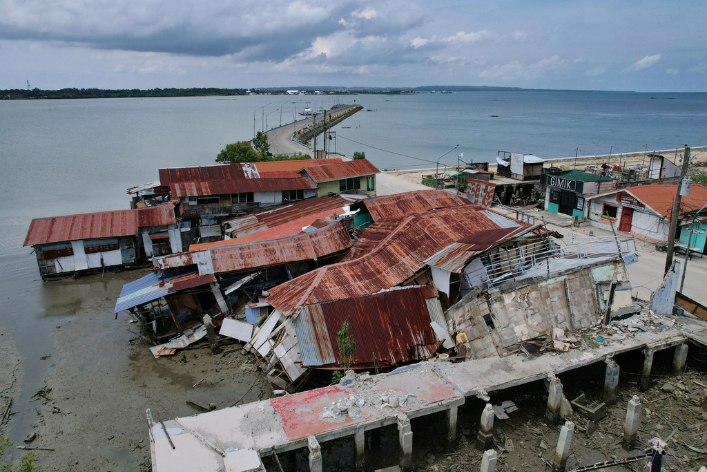 Business establishments that were damaged due to a recent strong earthquake lie at the Bogo city pier, Cebu Province, Central Philippines on Friday, Oct. 3, 2025. (AP Photo/Aaron Favila)