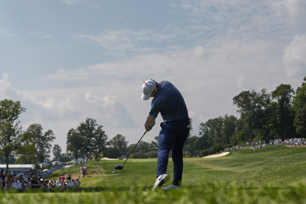 Robert MacIntyre, of Scotland, hits off the ninth tee during the final round of the BMW Championship golf tournament Sunday, Aug. 17, 2025, in Owings Mills, Md. (AP Photo/Stephanie Scarbrough)