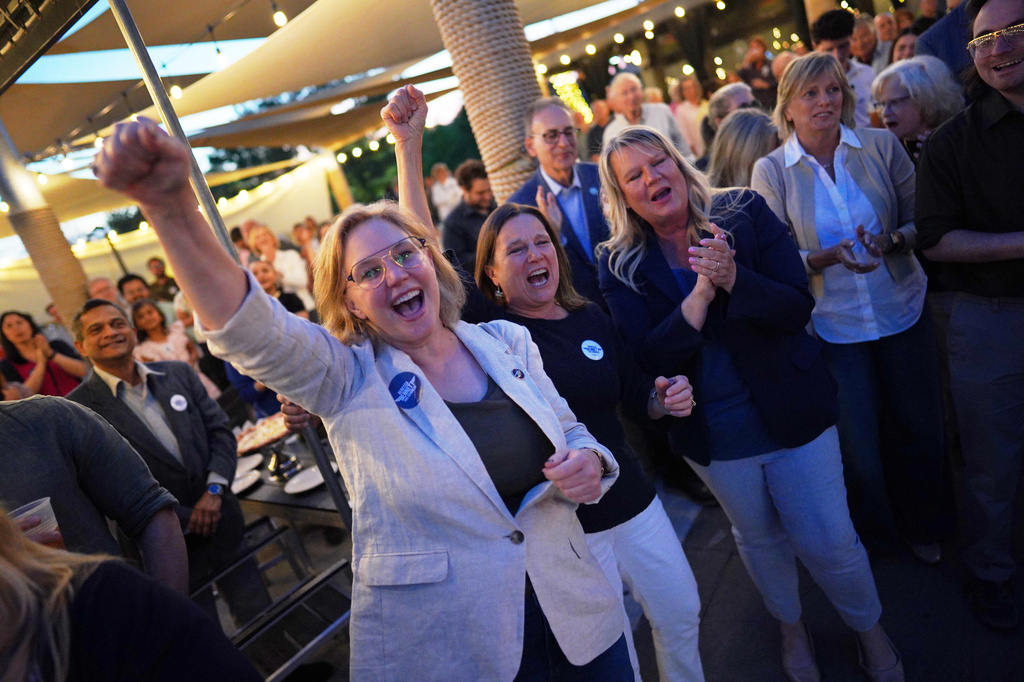 Supporters cheer during a primary election night watch party for Rebecca Bennett, Democratic candidate for New Jersey's 7th Congressional District, Tuesday, June 2, 2026, in Bridgewater, N.J. (AP Photo/Ryan Murphy)