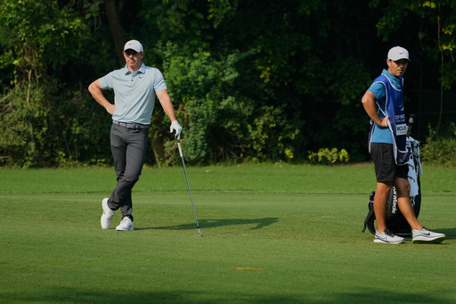 Rory McIlroy of Northern Ireland, left, waits for his turn to hit the ball during the DP World Tour Championship golf tournament in New Delhi, India, Thursday, Oct. 16, 2025. (AP Photo/Manish Swarup) Rory McIlroy of Northern Ireland, left, waits for his turn to hit the ball during the DP World Tour Championship golf tournament in New Delhi, India, Thursday, Oct. 16, 2025. (AP Photo/Manish Swarup)