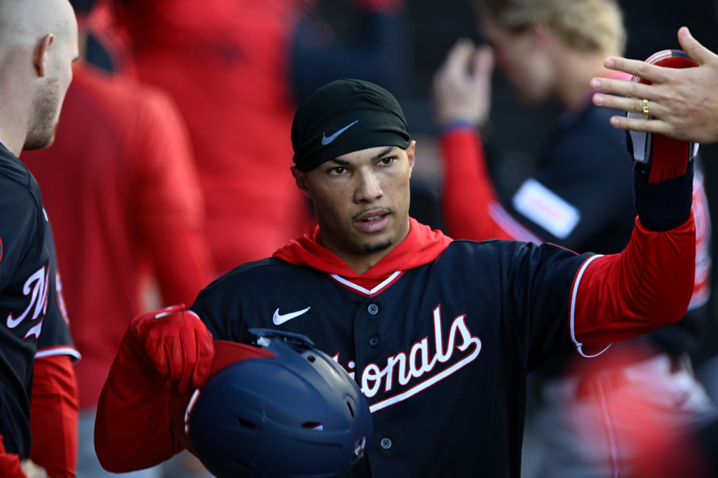 Washington Nationals' Daylen Lile celebrates with teammates in the dugout after scoring on a Nasim Nunez single during the fourth inning of a baseball game against the Chicago White Sox in Chicago, Saturday, April 25, 2026. (AP Photo/Paul Beaty)