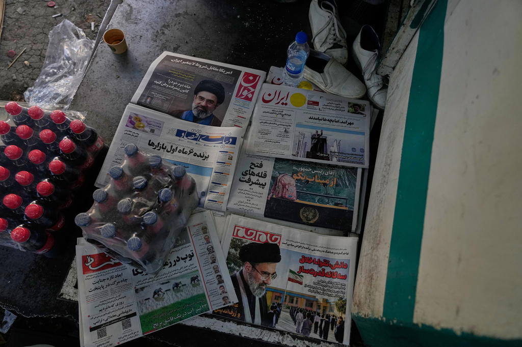 The front pages of Iranian newspapers show portraits of the Iranian Supreme Leader Ayatollah Mojtaba Khamenei, and headlines regarding the Shajareh Tayyebeh school that was hit in a Feb. 28 U.S. airstrike in Minab, at a square in northern Tehran, Iran, Wednesday, Sept. 23, 2026. (AP Photo/Vahid Salemi)