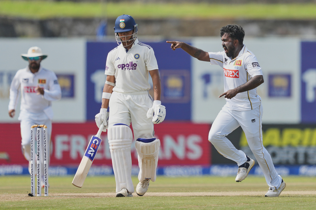 Sri Lanka's Asitha Fernando, right, celebrates taking the wicket of India's Yashasvi Jaiswal during the day four of the first cricket test match between Sri Lanka and India in Galle, Sri Lanka, Tuesday, Aug. 18, 2026. (AP Photo/Eranga Jayawardena)
