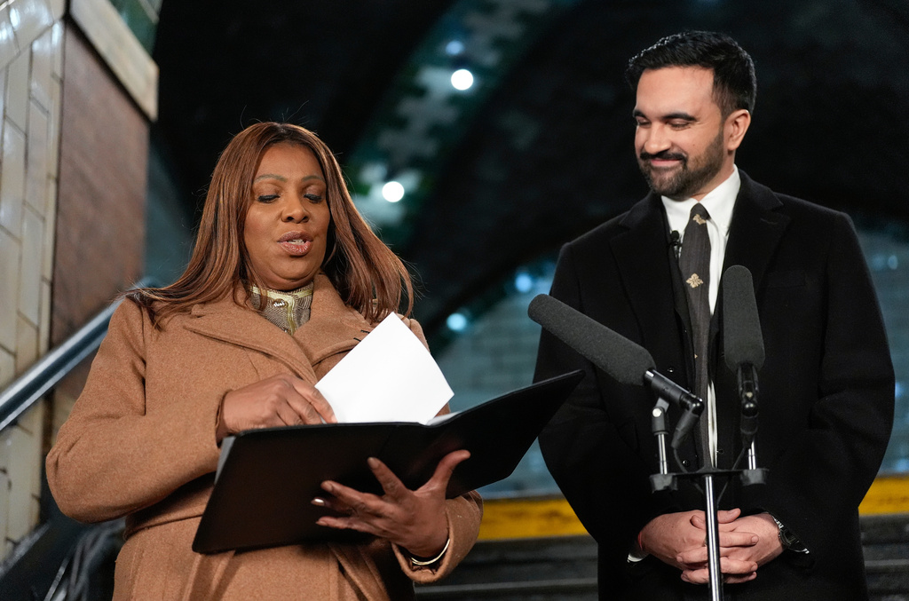 New York Attorney General Letitia James, left, prepare to administer the oath of office to mayor-elect Zohran Mamdani, Thursday, Jan. 1, 2026, in New York. (AP Photo/Yuki Iwamura)