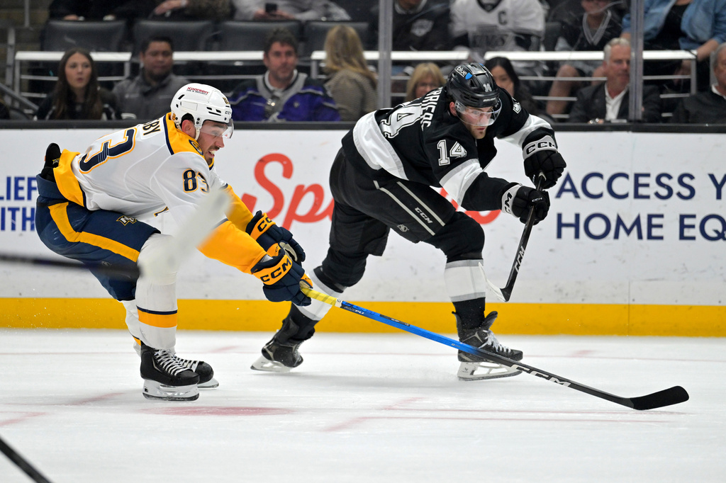 Nashville Predators defenseman Adam Wilsby, left, and Los Angeles Kings right wing Alex Laferriere battle for the puck during the second period of an NHL hockey game Thursday, April 2, 2026, in Los Angeles. (AP Photo/Jayne Kamin-Oncea)