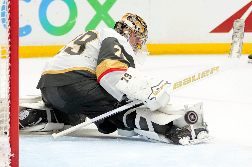 Vegas Golden Knights goaltender Carter Hart deflects a shot during the third period in Game 6 of a second-round NHL hockey Stanley Cup playoff series against the Anaheim Ducks, Thursday, May 14, 2026, in Anaheim, Calif. (AP Photo/Mark J. Terrill)