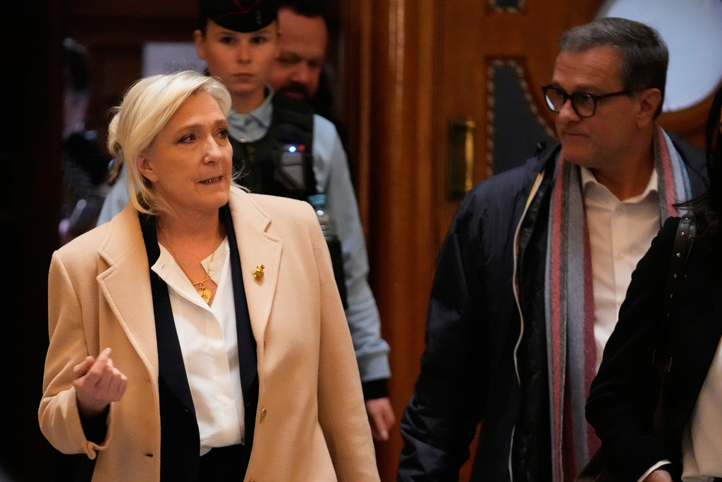 Far-right leader Marine Le Pen walks outside the courtroom during a short break in her appeals trial, in Paris, France, Wednesday, Feb. 11, 2026. (AP Photo/Michel Euler)