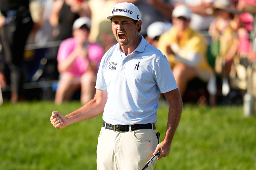 J.T. Poston celebrates after winning the Memorial golf tournament, Sunday, June 7, 2026, in Dublin, Ohio. (AP Photo/Sue Ogrocki)