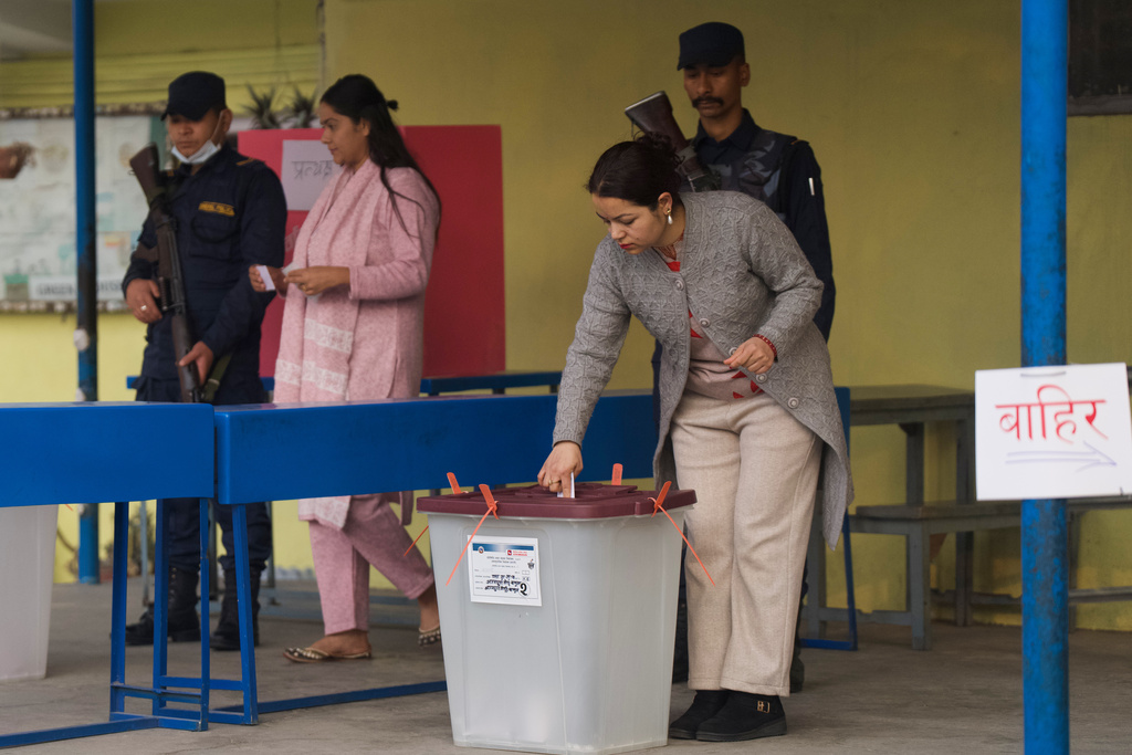A woman casts her vote at a polling station for the parliamentary election in Kathmandu, Nepal, Thursday, March 5, 2026. (AP Photo/Niranjan Shrestha)