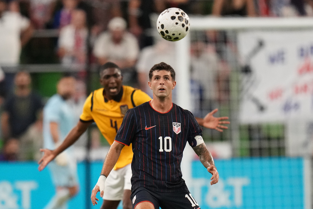 United States Christian Pulisic (10) looks for a pass in front of Ecuador defender Joel Ordonez (4) during the second half of an international friendly soccer match in Austin, Texas, Friday, Oct. 10, 2025. (AP Photo/Eric Gay)