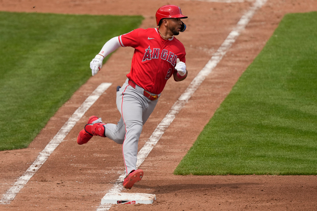 Los Angeles Angels' Oswald Peraza rounds first base after hitting a solo home run in the fourth inning of a baseball game against the Cincinnati Reds in Cincinnati, Sunday, April 12, 2026. (AP Photo/Carolyn Kaster)