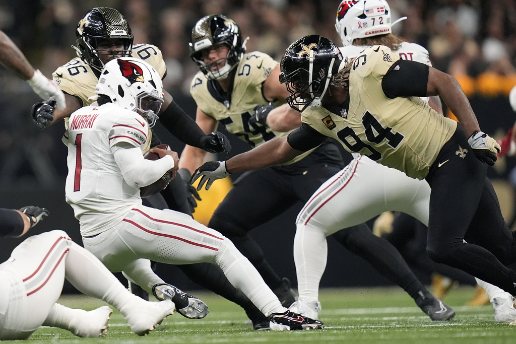 Arizona Cardinals quarterback Kyler Murray (1) gets stopped by New Orleans Saints defensive ends Cameron Jordan (94) and Carl Granderson (96) during the second half of an NFL football game Sunday, Sept. 7, 2025, in New Orleans. (AP Photo/Gerald Herbert)