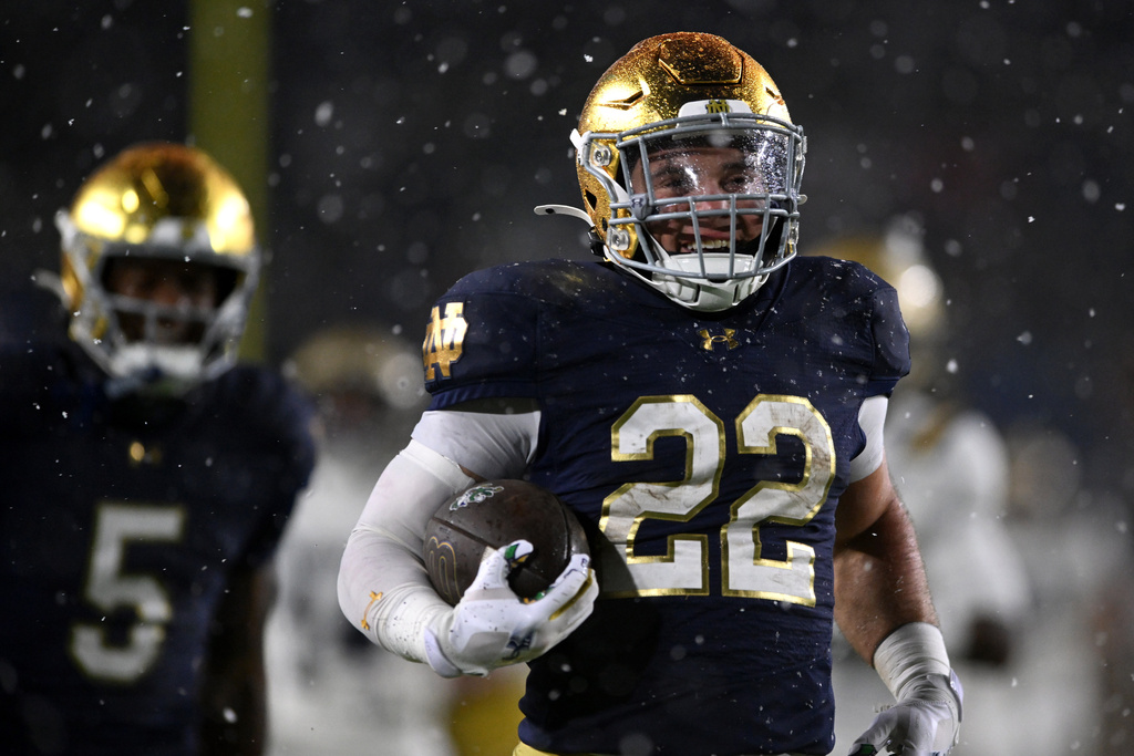 Notre Dame running back Aneyas Williams (22) rushes for a touchdown during the fourth quarter of an NCAA football game against Navy, Saturday, Nov. 8, 2025, in South Bend, Ind. (AP Photo/Paul Beaty)