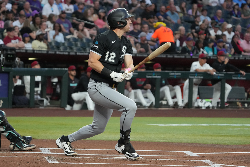 Chicago White Sox' Colson Montgomery hits a two-run double against the Arizona Diamondbacks in the first inning of a baseball game, Tuesday, April 21, 2026, in Phoenix. (AP Photo/Rick Scuteri)
