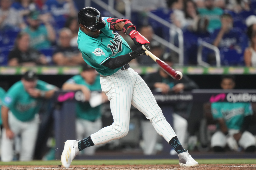 Miami Marlins' Esteury Ruiz hits a single during the eighth inning of a baseball game against the Los Angeles Dodgers, Sunday, Sept. 13, 2026, in Miami. (AP Photo/Lynne Sladky)