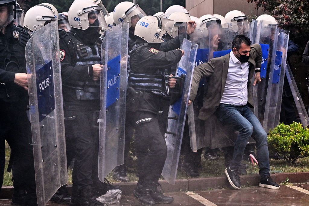 Police officers storm Turkey's main opposition Republican People's Party (CHP) headquarters to evict supporters gathered inside for party leader Ozgur Ozel, in Ankara, Sunday, May 24, 2026. (AP Photo/Ali Unal)