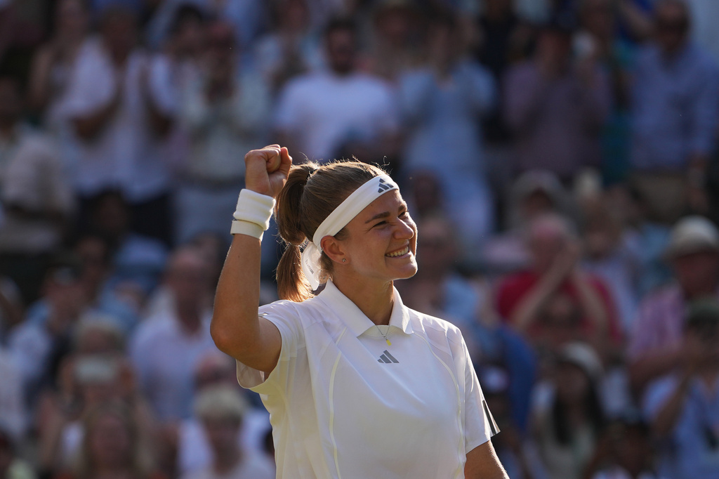 Karolina Muchova of Czech Republic celebrates her victory against Naomi Osaka of Japan in their quarter-final women's singles match at the Wimbledon Tennis Championships in London, Tuesday, July 7, 2026. (AP Photo/Kin Cheung)