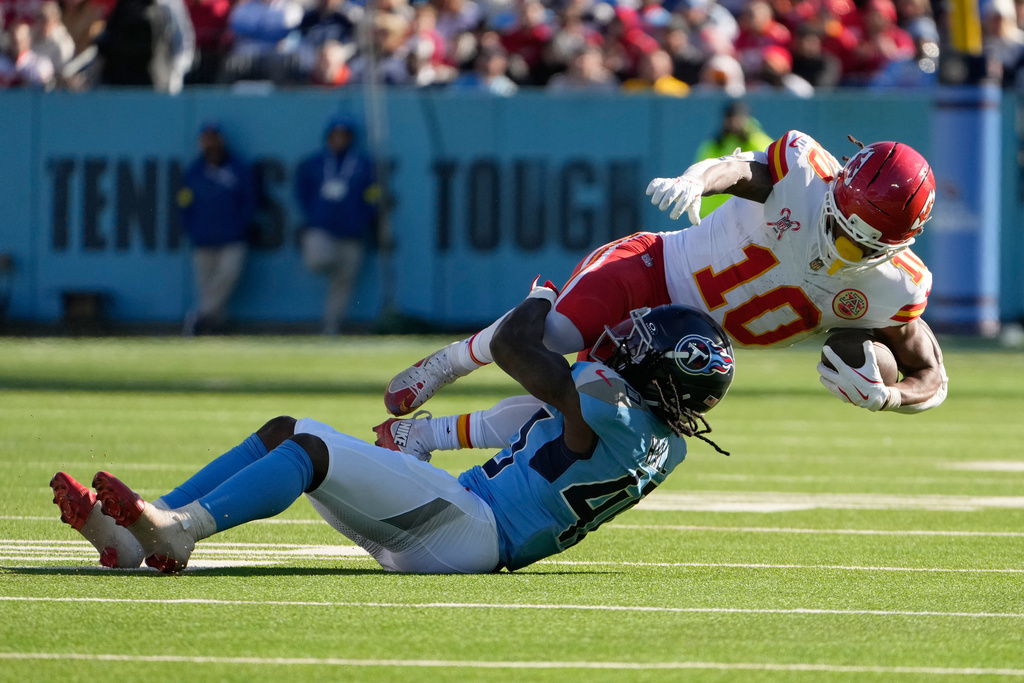 Kansas City Chiefs running back Isiah Pacheco (10) is tackled by Tennessee Titans cornerback Kemon Hall (40) during the first half of an NFL football game, Sunday, Dec. 21, 2025, in Nashville, Tenn. (AP Photo/George Walker IV)