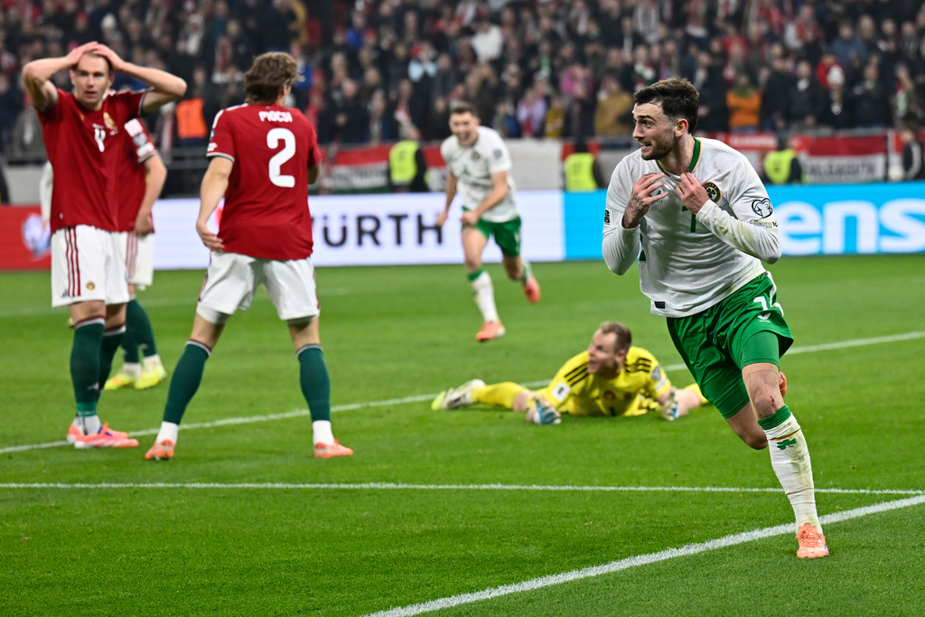 Ireland's Troy Parrott, right, celebrates after scoring his side's third goal during the World Cup 2026 group F qualifying soccer match between Hungary and Ireland in Budapest, Hungary, Sunday, Nov. 16, 2025. (AP Photo/Denes Erdos)