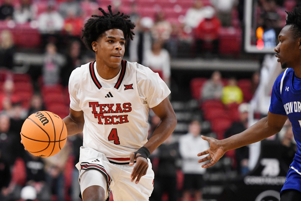 Texas Tech guard Christian Anderson (4) dribbles the ball during the first half in an NCAA college basketball game against New Orleans, Wednesday, Nov. 26, 2025, in Lubbock, Texas. (AP Photo/Annie Rice)