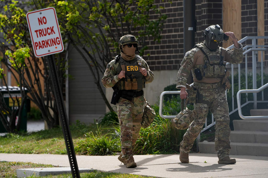 Enforcement and Removal Operations agents walk outside the U.S. Immigration and Customs Enforcement (ICE) building Wednesday, Sept. 24, 2025, in Broadview, Ill. (AP Photo/Erin Hooley)
