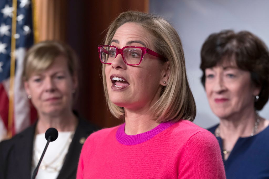 FILE - Sen. Kyrsten Sinema, D-Ariz., speaks to reporters following Senate passage of the Respect for Marriage Act, at the Capitol in Washington, Nov. 29, 2022. (AP Photo/J. Scott Applewhite, File)
