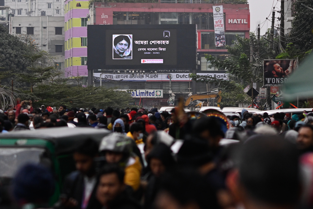 A portrait of former Bangladeshi Prime Minister Khaleda Zia is displayed on a digital screen near the hospital where she died, in Dhaka, Bangladesh, Monday, Dec. 30, 2025. (AP Photo/Mahmud Hossain Opu)