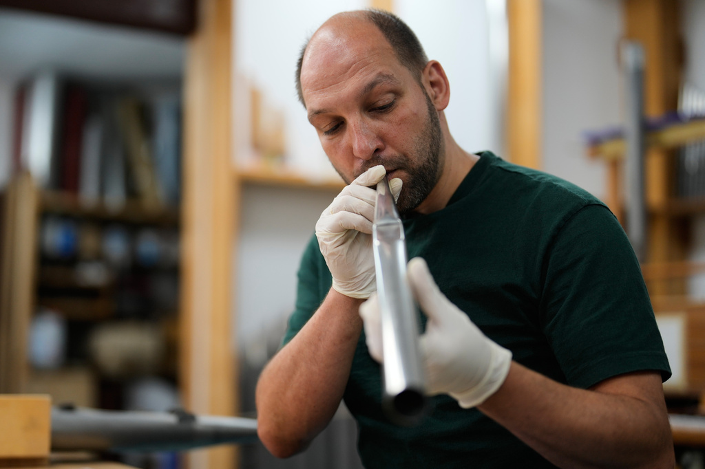 Organ builder Johannes Huefken works on organ pipe for the John Cage organ project at his work shop in Halberstadt, Germany, July 6, 2026. (AP Photo/Matthias Schrader)