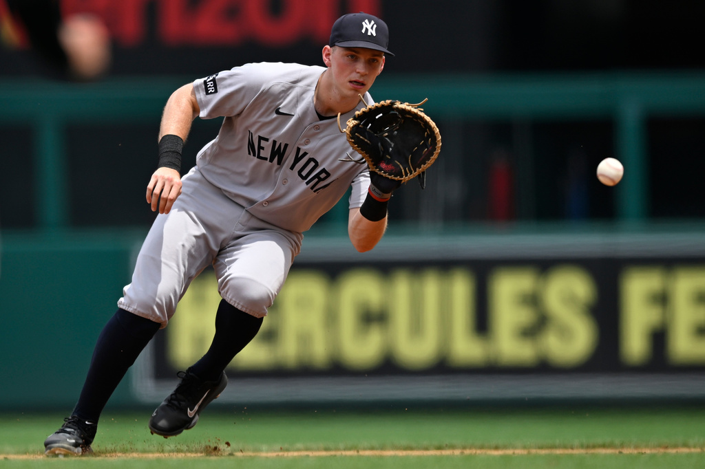 New York Yankees first baseman Ben Rice fields a ground ball to put out Washington Nationals' CJ Abrams during the first inning of a baseball game, Sunday July 12, 2026, in Washington. (AP Photo/John McDonnell)