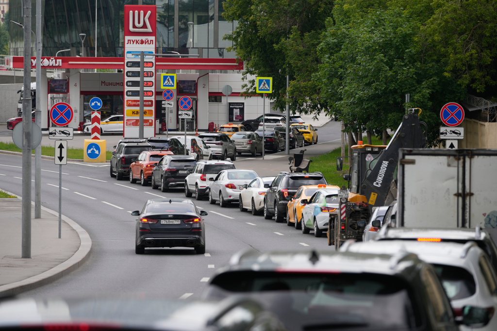 FILE - Cars line up at a Lukoil gas station in Moscow, Monday, June 29, 2026. (AP Photo/Pavel Bednyakov, File)