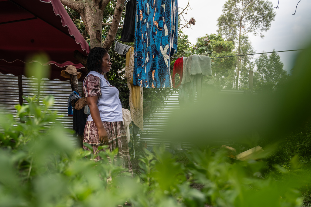 Esther Lutula, a 26 year-old woman who is four months pregnant and a mother of four, who stopped going for prenatal checkups shortly after the current Ebola outbreak, stands outside her house in Bunia, northeastern, Congo, Tuesday, June 16, 2026. (AP Photo/Moses Sawasawa)
