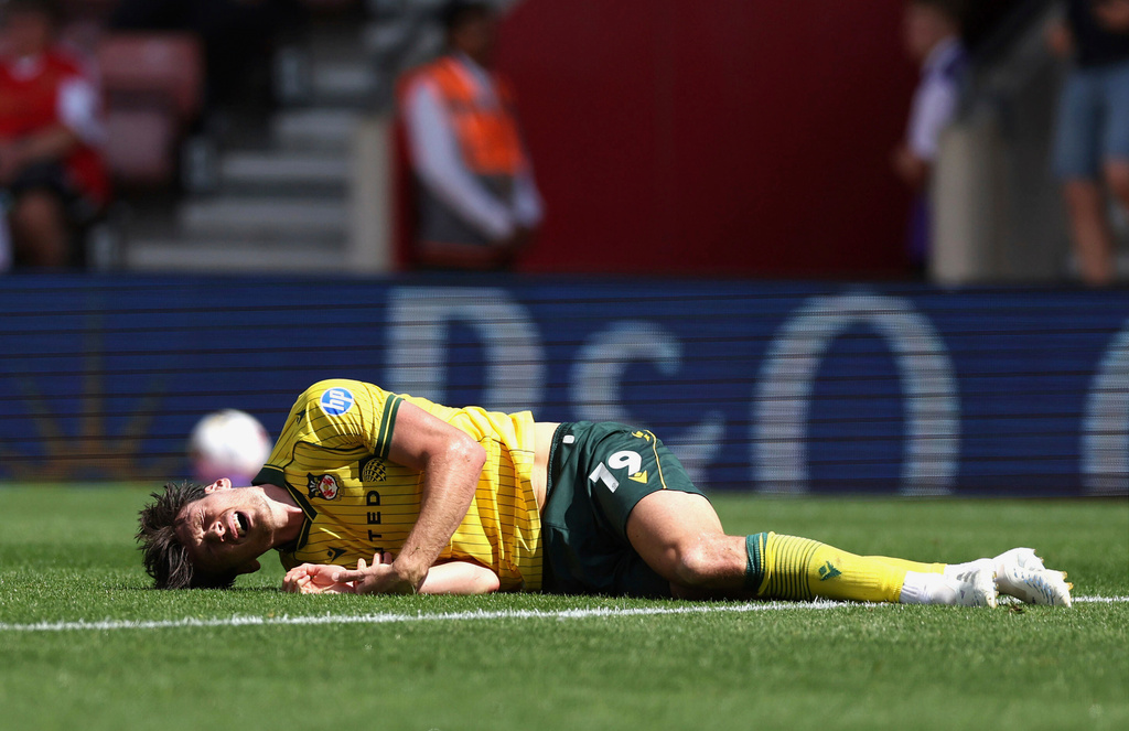Wrexham's Kieffer Moore lays injured during their English Football League Championship soccer match against Southampton, at St Mary's Stadium, Southampton, England, Saturday, Aug. 9, 2025. (Steven Paston/PA via AP)