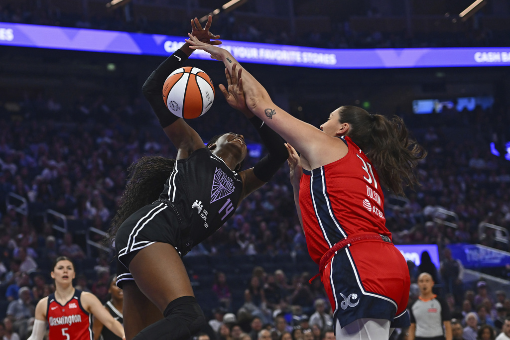Washington Mystics' Stefanie Dolson blocks a shot by Golden State Valkyrie's Temi Fagbenle in the first quarter of a WNBA basketball game at Chase Center in San Francisco, Saturday, Aug. 30, 2025. (Jose Carlos Fajardo/Bay Area News Group via AP)