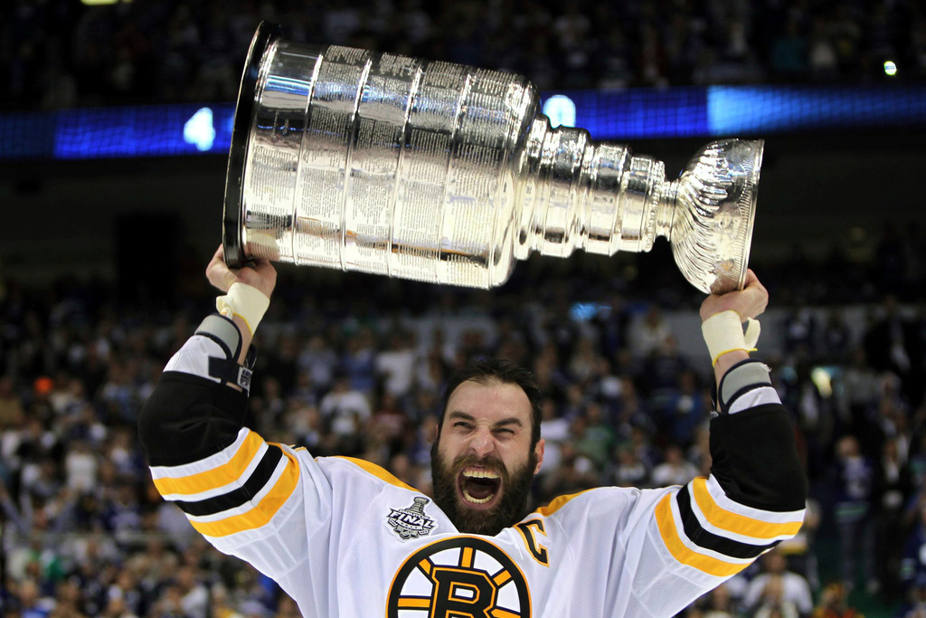 FILE - Boston Bruins' Zdeno Chara, of Slovakia, hoists the cup following the Bruins' 4-0 win over the Vancouver Canucks in Game 7 of the NHL hockey Stanley Cup Finals on June 15, 2011, in Vancouver, British Columbia, Canada. (Jonathan Hayward/The Canadian Press via AP)