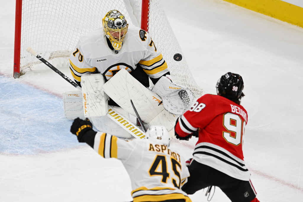 Boston Bruins goalie Joonas Korpisalo (70) makes a save against Chicago Blackhawks' Connor Bedard (98) during the second period of an NHL hockey game Saturday, Jan. 17, 2026, in Chicago. (AP Photo/Paul Beaty)