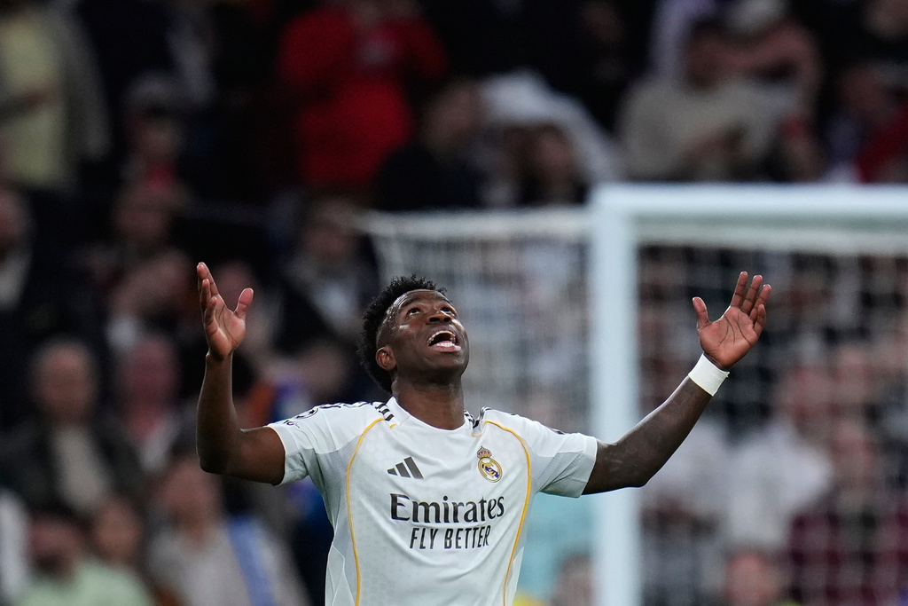 Real Madrid's Vinicius Junior celebrates after scoring his side's second goal during the second leg of the Champions League playoff soccer match between Real Madrid and Benfica in Madrid, Spain, Wednesday, Feb. 25, 2026. (AP Photo/Manu Fernandez)
