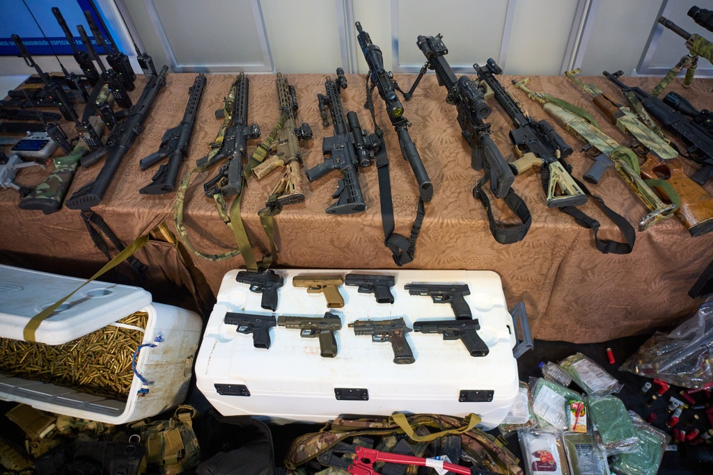 Weapons that Cuban authorities say were recovered from a speedboat in Cuban waters following a confrontation that left four people dead are displayed during a media presentation in Havana, Friday, Feb. 27, 2026. (AP Photo/Ramon Espinosa)