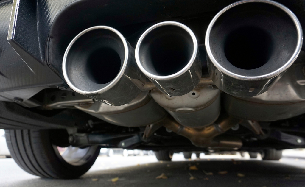 FILE - Exhaust pipes of a car are pictured in Berlin, Germany, Tuesday, Oct. 9, 2018. (AP Photo/Michael Sohn, File)