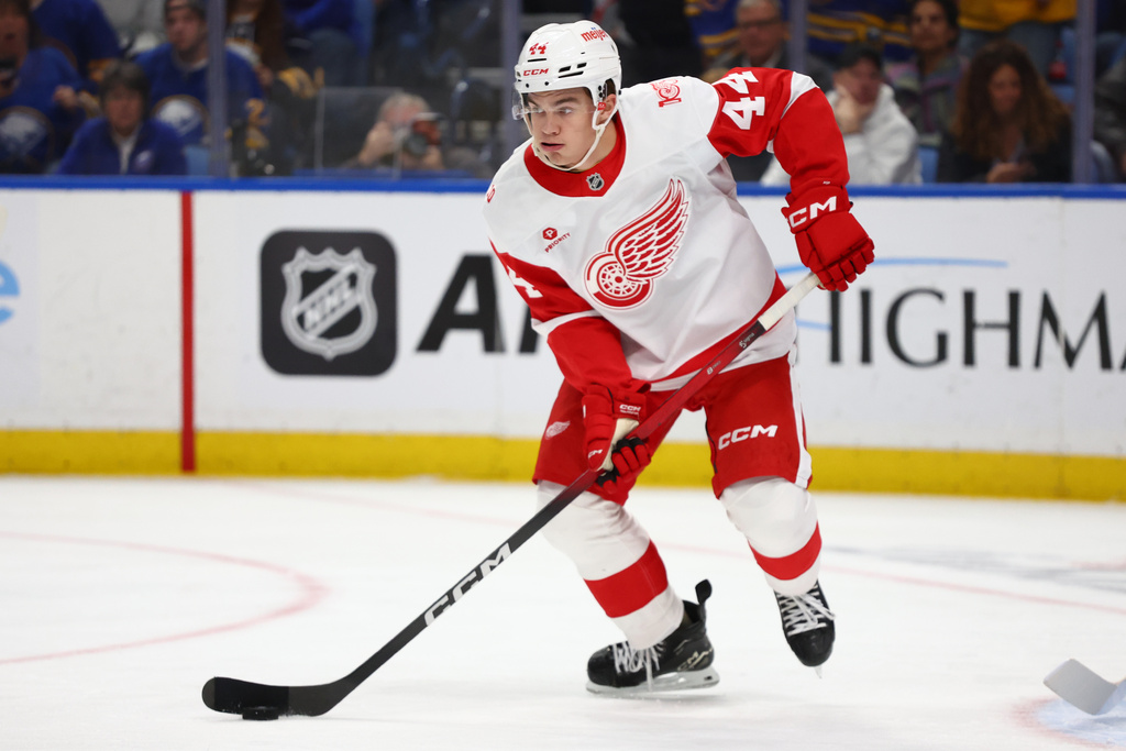 Detroit Red Wings defenseman Axel Sandin-Pellikka (44) brings the puck up ice during the first period of an NHL hockey game against the Buffalo Sabres Wednesday, Oct. 22, 2025, in Buffalo, N.Y. (AP Photo/Jeffrey T. Barnes)