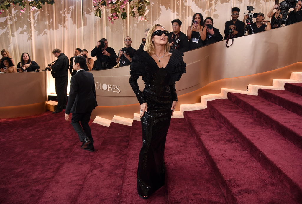 Miley Cyrus arrives at the 83rd Golden Globes on Sunday, Jan. 11, 2026, at the Beverly Hilton in Beverly Hills, Calif. (Photo by Richard Shotwell/Invision/AP)