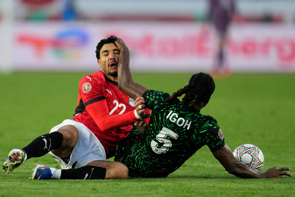 Egypt's Omar Marmoush and Nigeria's Igoh Ogbu compete for the ball during the Africa Cup of Nations third place game between Egypt and Nigeria in Casablanca, Morocco, Saturday, Jan. 17, 2026. (AP Photo/Themba Hadebe)